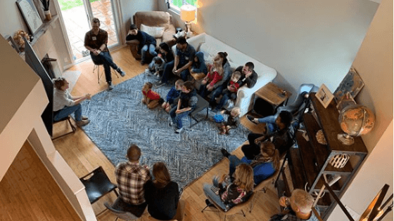 Group of people meet in a living room