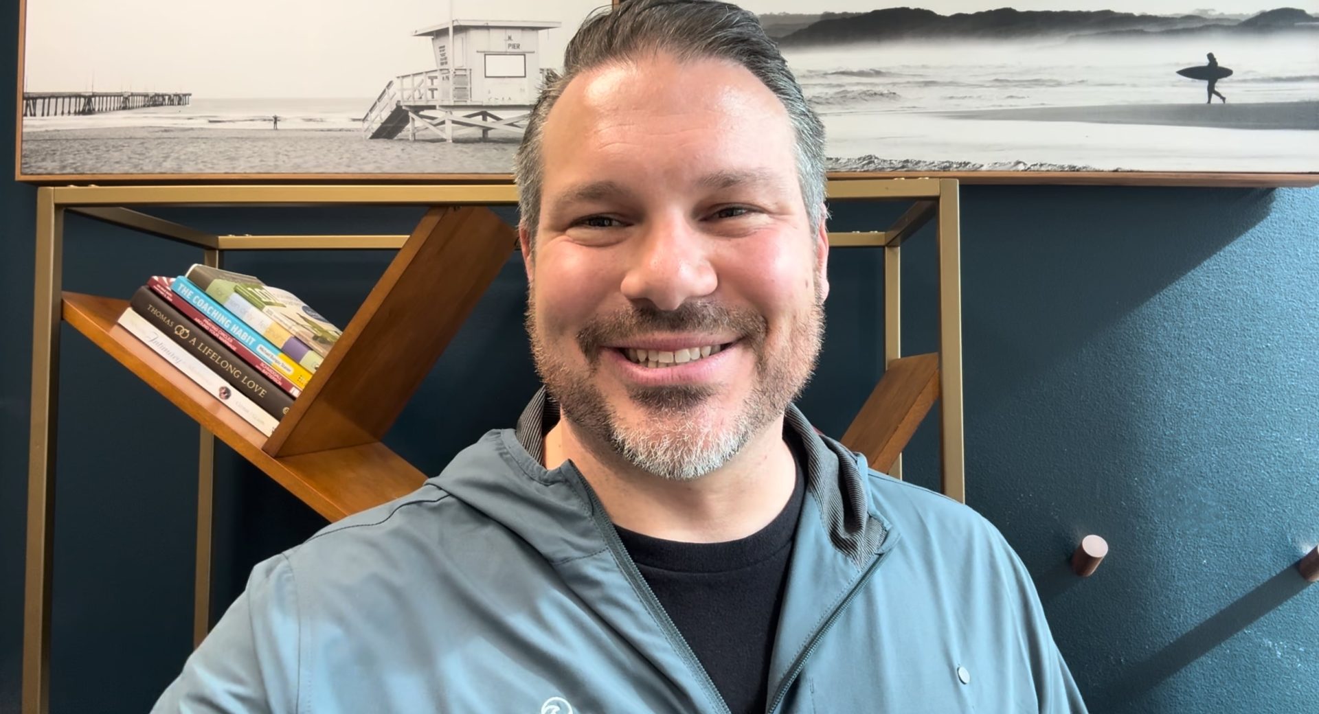 Pastor Philip in his office smiling at the camera.